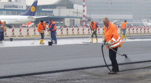 Densit has been invited by six Middle East airports, including Dubai, to give trials for its<br>pavement product, Densiphalt, pictured being laid at Dusseldorf Airport in Germany.