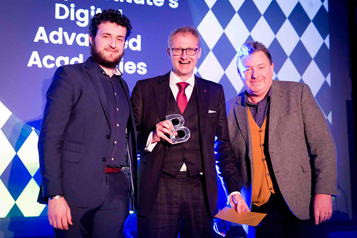 Adam Young (left), associate academies manager, and Iain Miskimmin (center), senior academies manager for Bentley Institute’s Digital Advancement Academies, accepted the BIM Enabler/Consultant of the Year Award at BIM Show Live 2019.