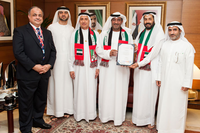 Sheikh Ahmed Bin Saeed receives the ISO certificate from DAFZA in presence of Dr Al Zarooni.