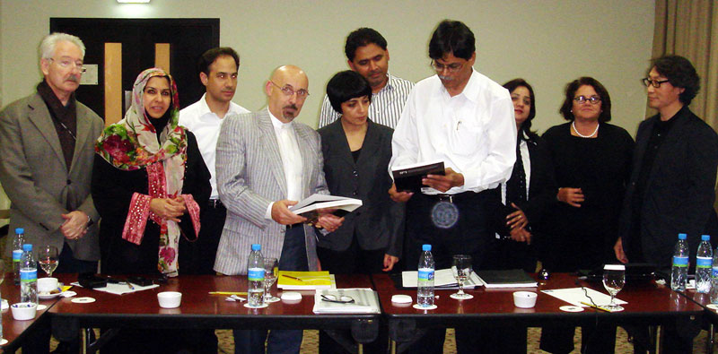 Members of IFI and APID during the signing ceremony.