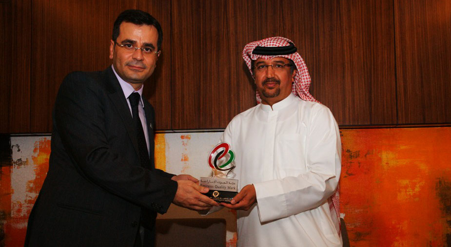 Modar Al Mekdad and Mr. Mohammad Saleh Badri from ESMA while receiving the Emirates Quality Mark award.