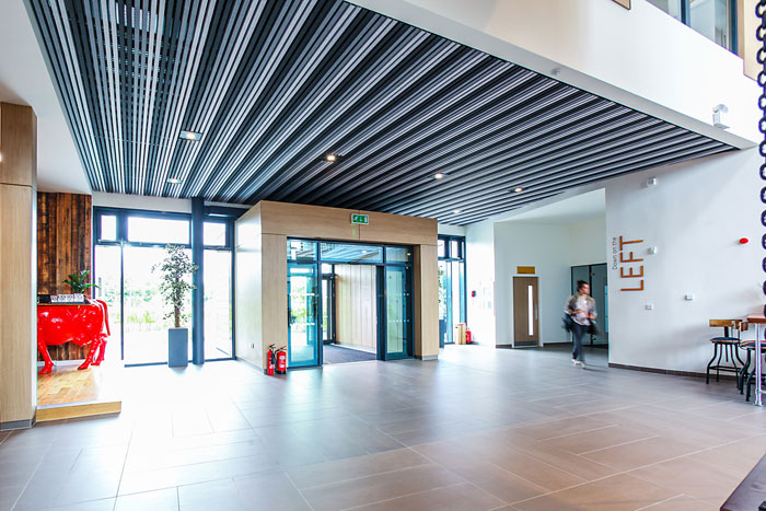 HeartFelt™ linear ceilings from Hunter Douglas Architectural: The Moneypenny Headquarters in Wrexham, United Kingdom.