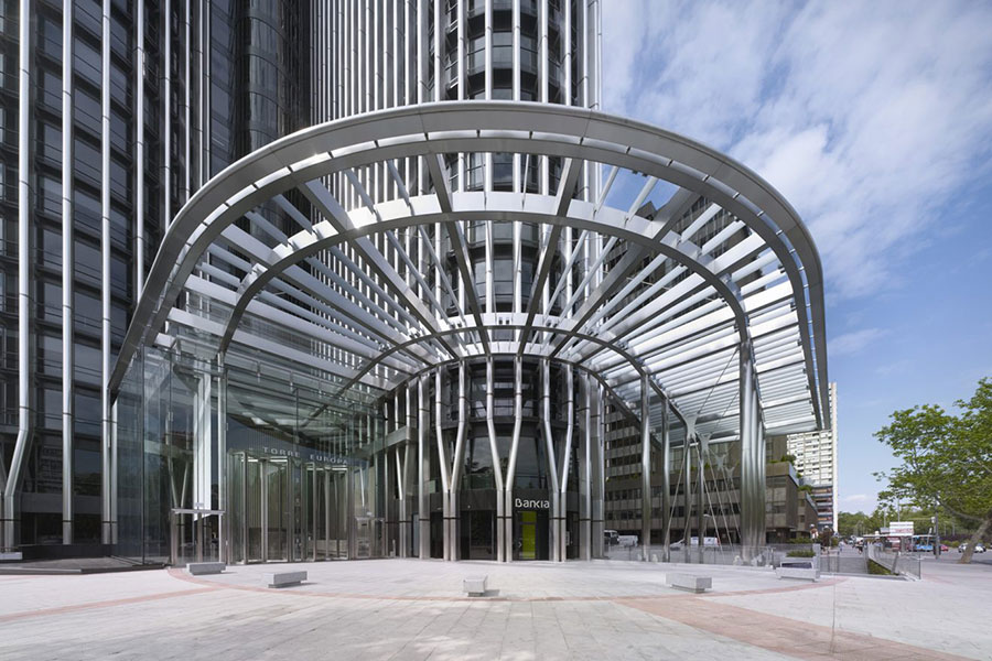 An example of the Baupore tall, all-glass revolving door being introduced in the Middle East, showcased on the Torre Europa building in Europe.