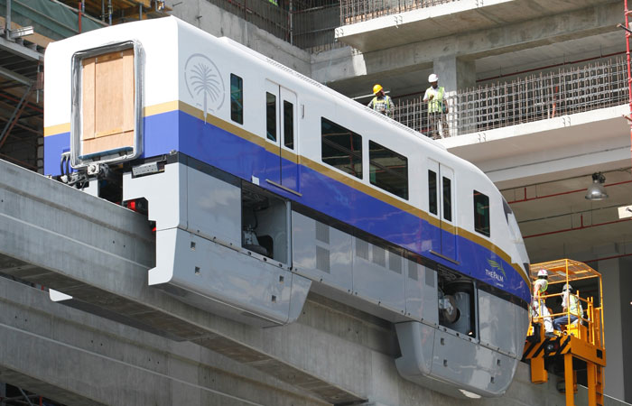The first Palm Monorail train is raised onto the 5.45km track on Palm Jumeirah.