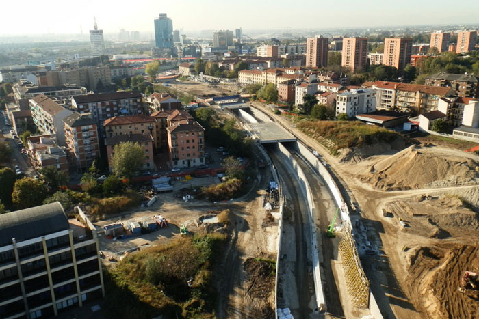 Closer view of the work on the concrete tunnel entry for the Zara-Expo connector, with Milano, Italy on the horizon.