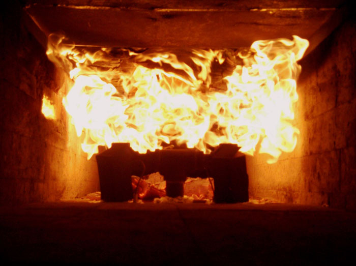 Steiner Tunnel test, showing the flame being applied to the ceiling, is an inadequate and inappropriate method for testing insulation safety.
